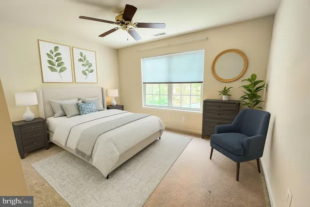 a bedroom with a bed dresser and a window