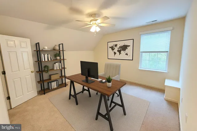 a workspace with furniture and window