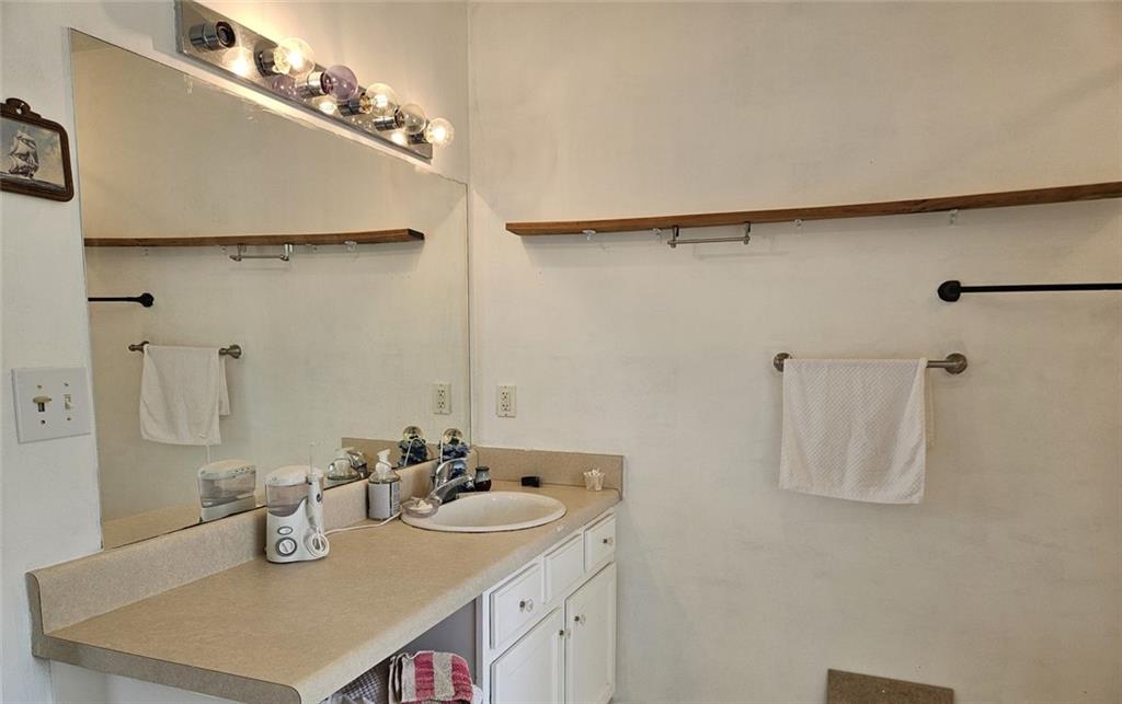 80 Jacob Trail Rockmart, GA 30153 - Photo 13 of 24 a bathroom with a sink and mirror
