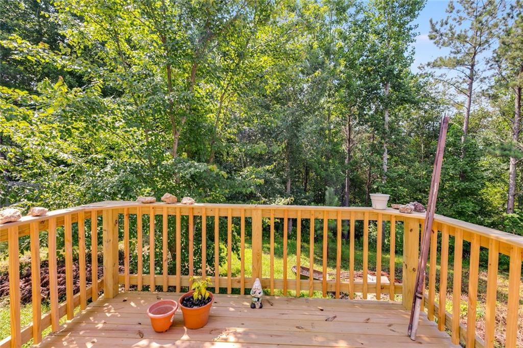 80 Jacob Trail Rockmart, GA 30153 - Photo 21 of 24 a view of a chair and table of the wooden fence