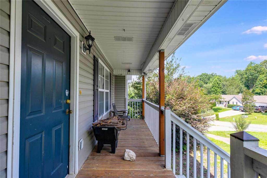 80 Jacob Trail Rockmart, GA 30153 - Photo 3 of 24 a view of a porch with wooden floor and furniture