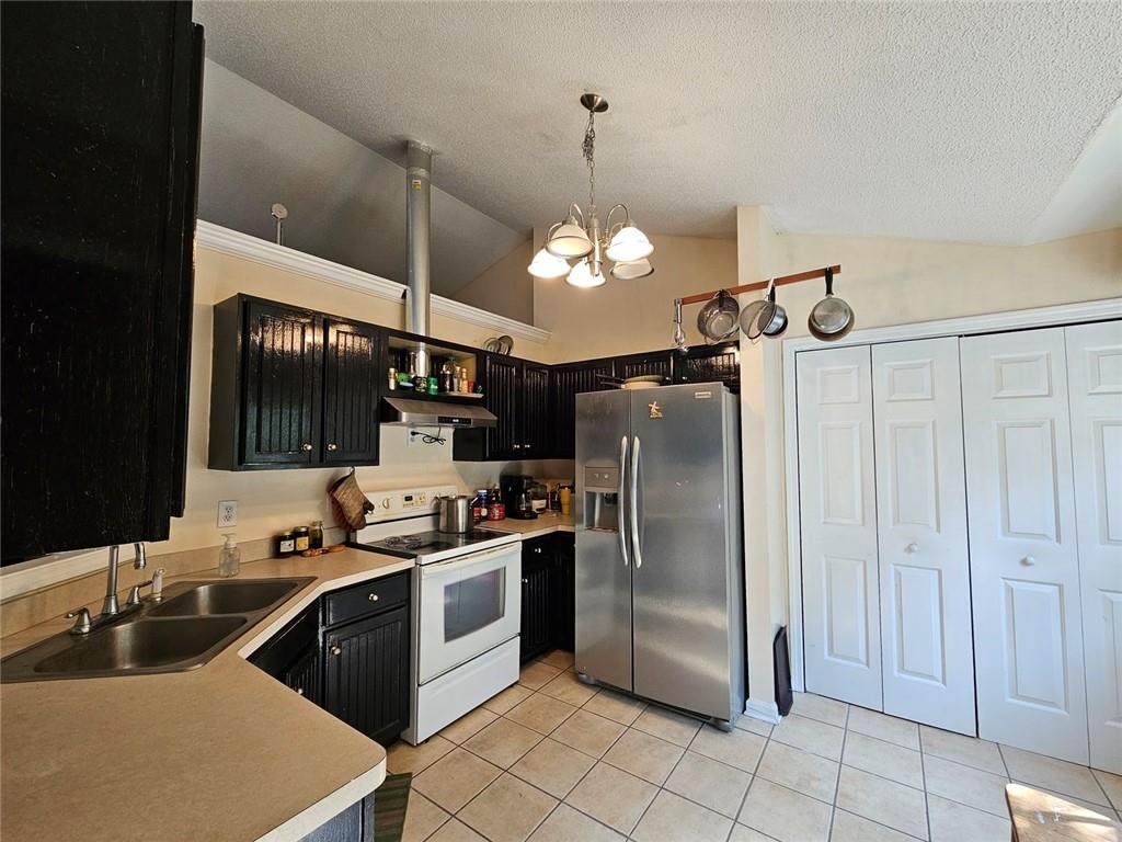 80 Jacob Trail Rockmart, GA 30153 - Photo 8 of 24 a kitchen with stainless steel appliances a sink cabinets and refrigerator