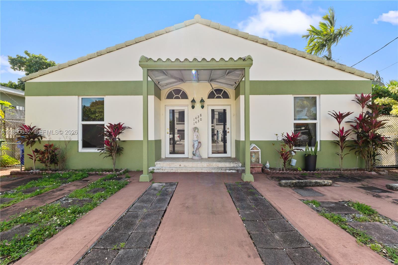 1428 Southwest 20th Street Miami, FL 33145 - Photo 15 of 63 a front view of a house with garden