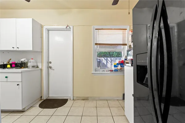 a bedroom with a bed and a television