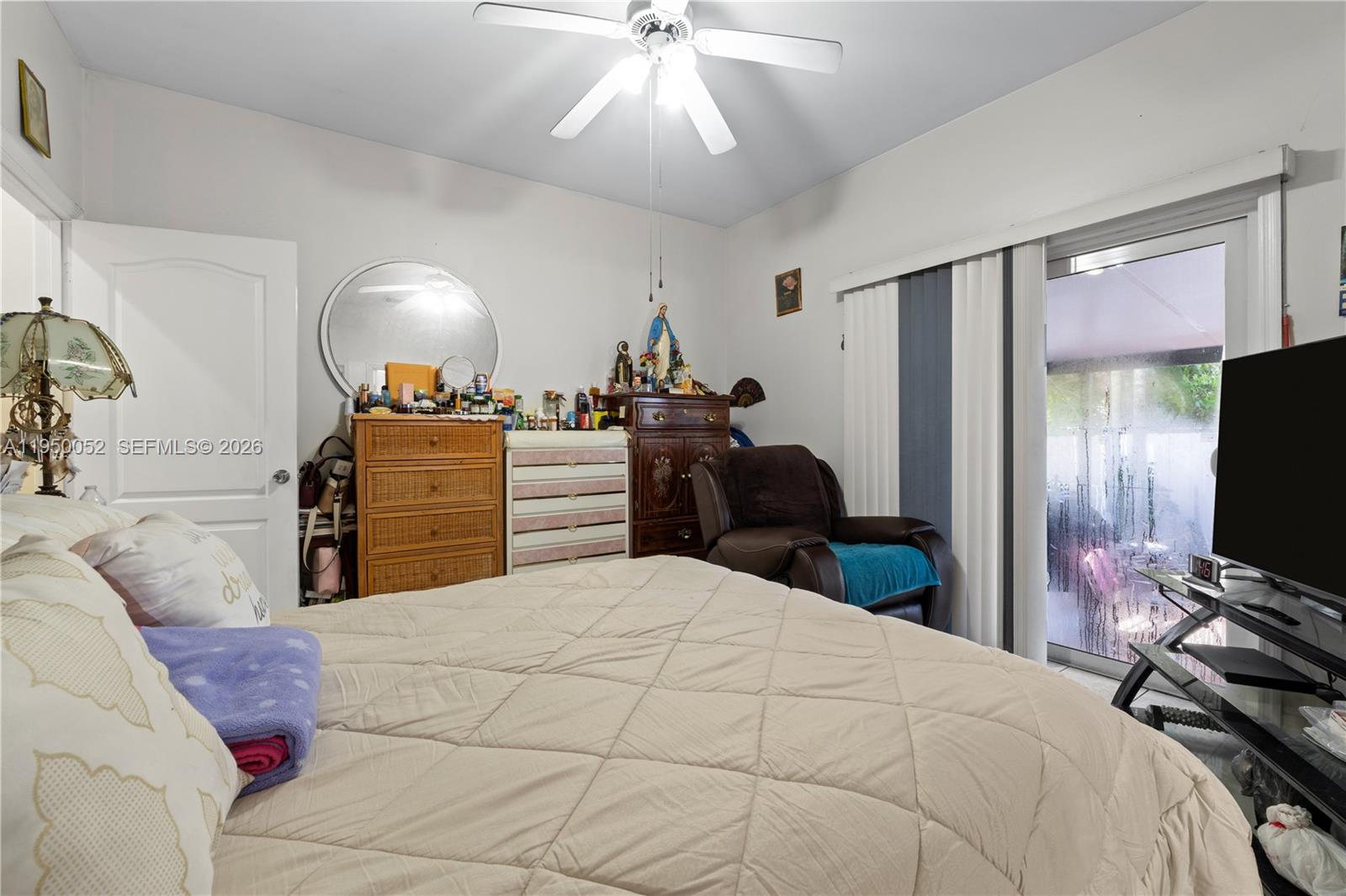 1428 Southwest 20th Street Miami, FL 33145 - Photo 59 of 63 a bedroom with a bed and a flat tv screen on dresser