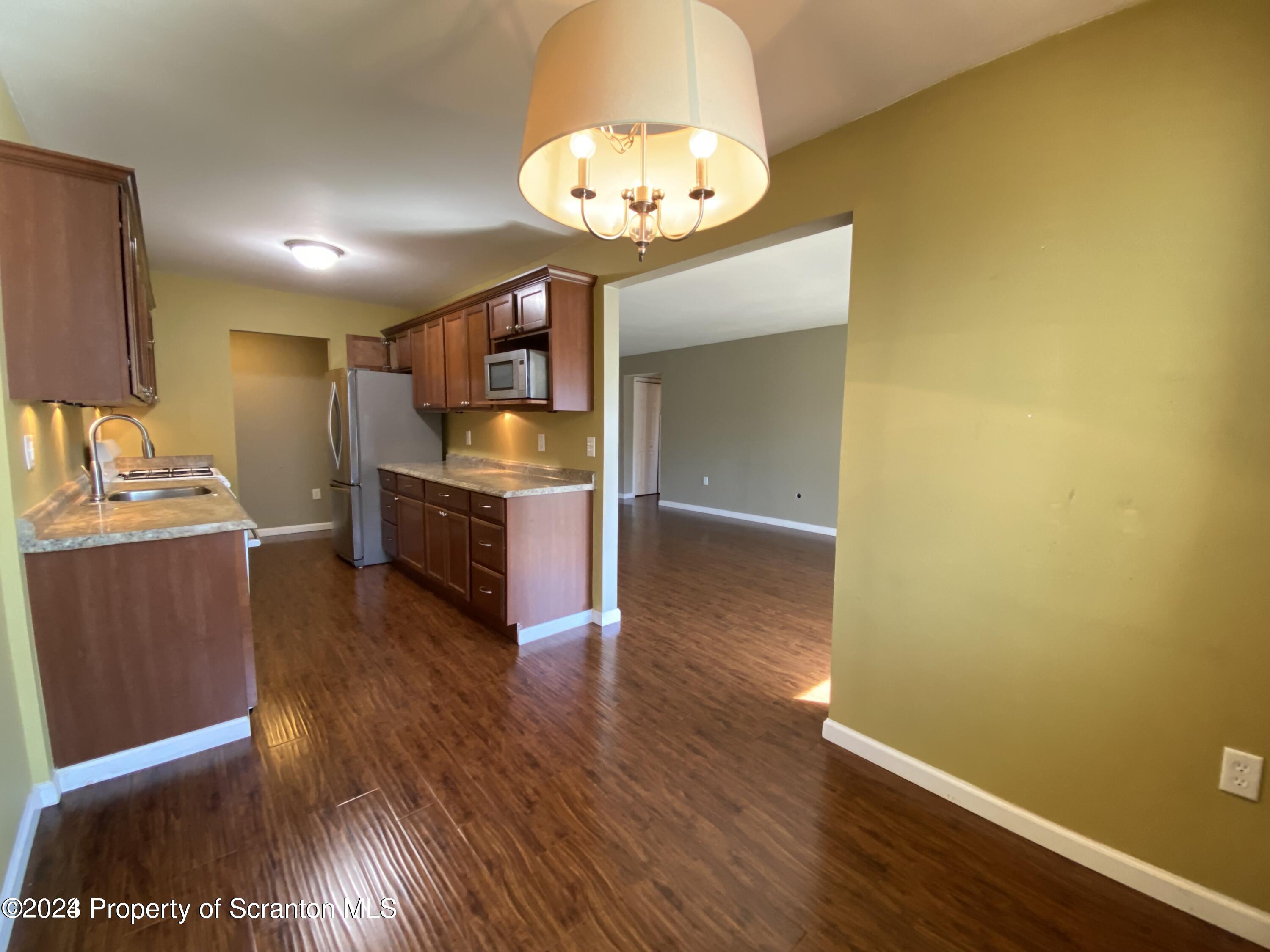1702 Summit Pointe Scranton, PA 18508 - Photo 9 of 30 a view of kitchen with cabinets and wooden floor