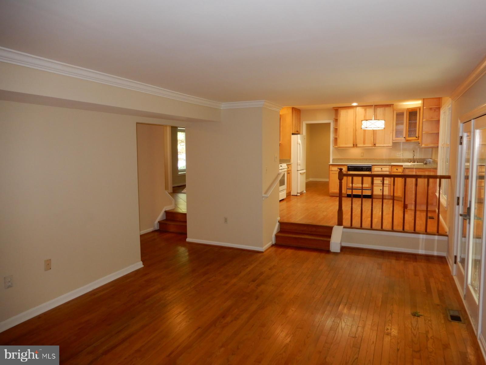 7014 Maple Tree Lane Springfield, VA 22152 - Photo 16 of 56 an empty room with wooden floor and windows