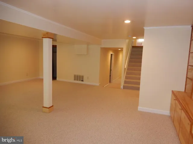 a view of an empty room with a fireplace