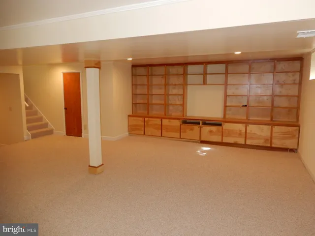 a bathroom with a toilet and a mirror