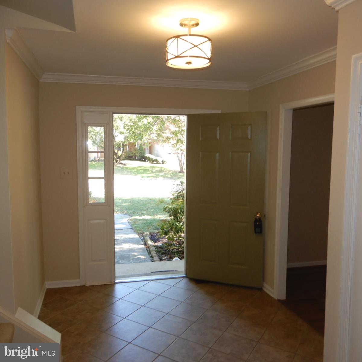 7014 Maple Tree Lane Springfield, VA 22152 - Photo 3 of 56 a view of an empty room with a window
