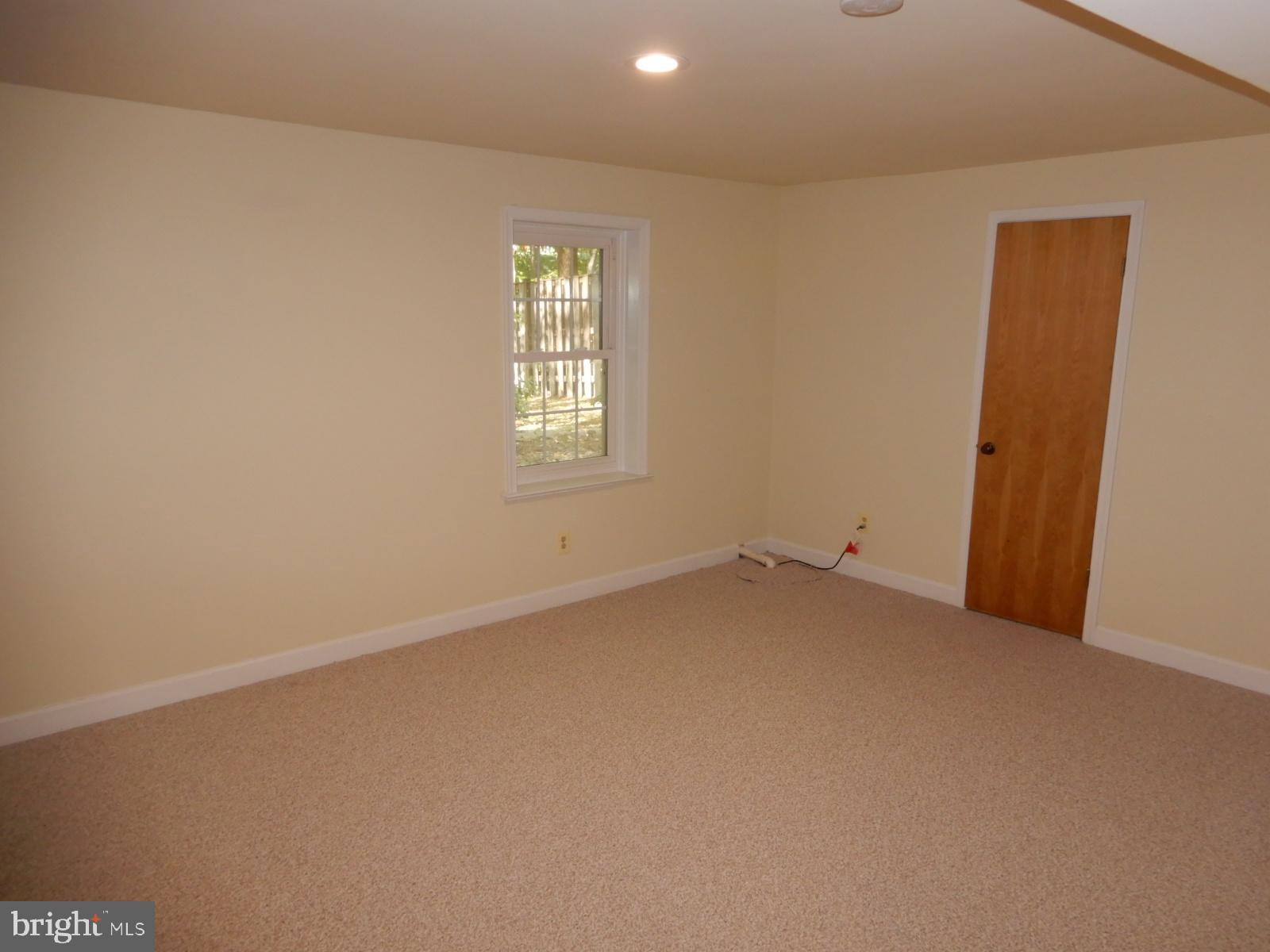 7014 Maple Tree Lane Springfield, VA 22152 - Photo 31 of 56 an empty room with windows