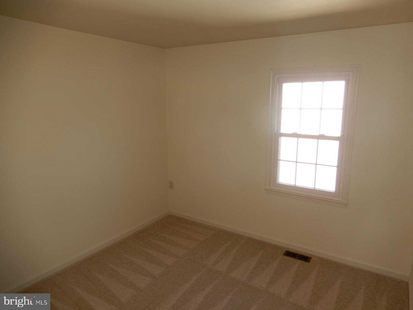 7014 Maple Tree Lane Springfield, VA 22152 - Photo 40 of 56 an empty room with a window