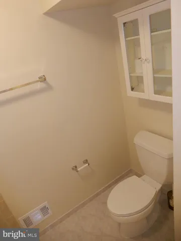 a view of backyard with wooden fence and trees