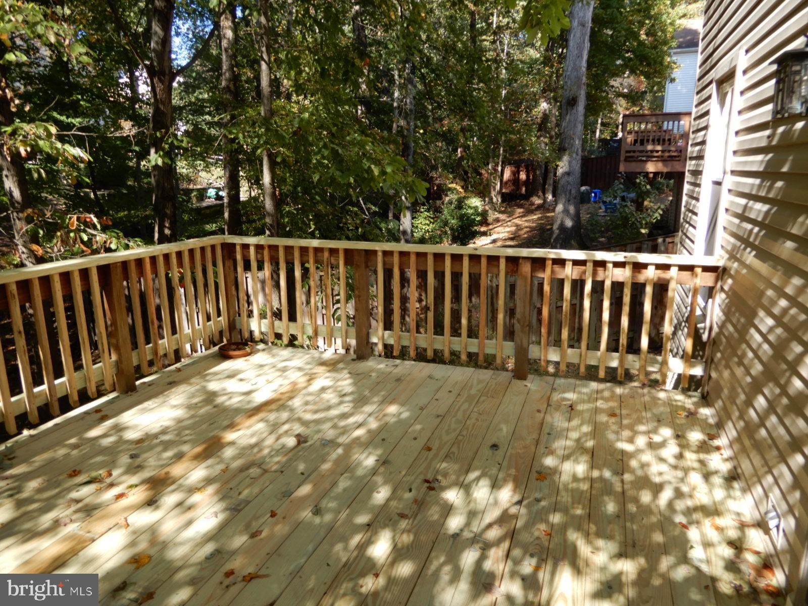 7014 Maple Tree Lane Springfield, VA 22152 - Photo 52 of 56 a view of backyard with wooden fence and trees