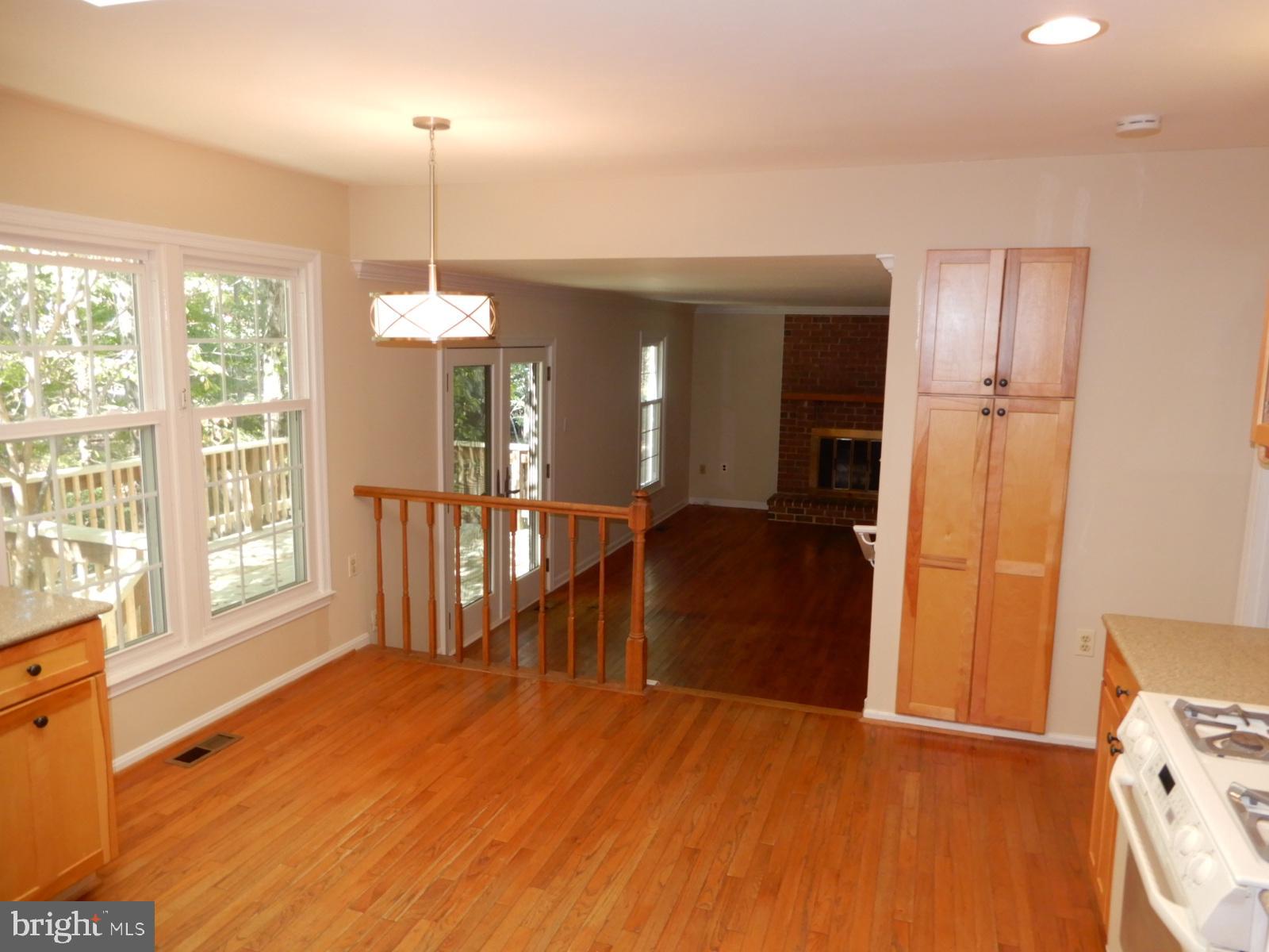 7014 Maple Tree Lane Springfield, VA 22152 - Photo 8 of 56 a view of a room with wooden floor and a window