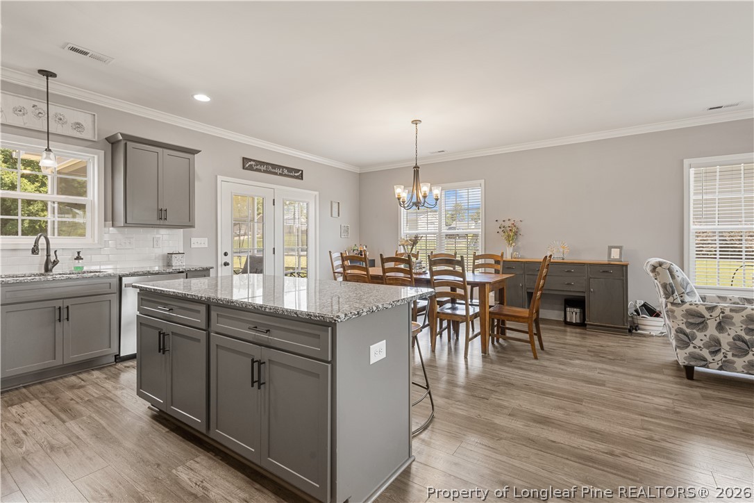 137 Minter School Road Sanford, NC 27332 - Photo 15 of 50 a kitchen with lots of counter and chairs