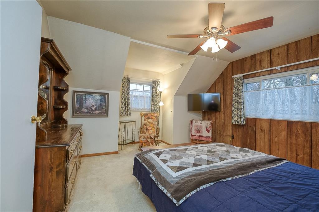 422 Mars Road Mars, PA 16046 - Photo 15 of 19 a bedroom with a bed and a chandelier