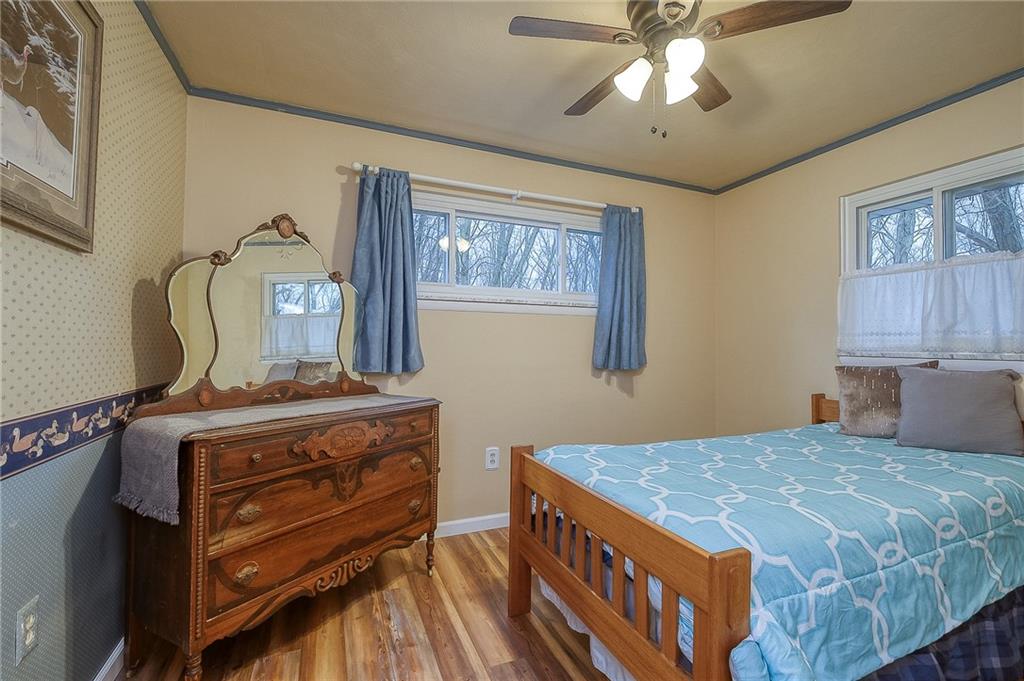 422 Mars Road Mars, PA 16046 - Photo 16 of 19 a bedroom with a bed and wooden floor