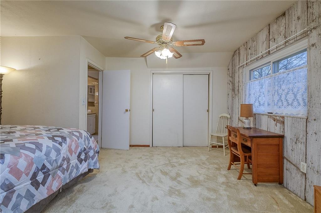 422 Mars Road Mars, PA 16046 - Photo 19 of 19 a bedroom with a bed and a chandelier