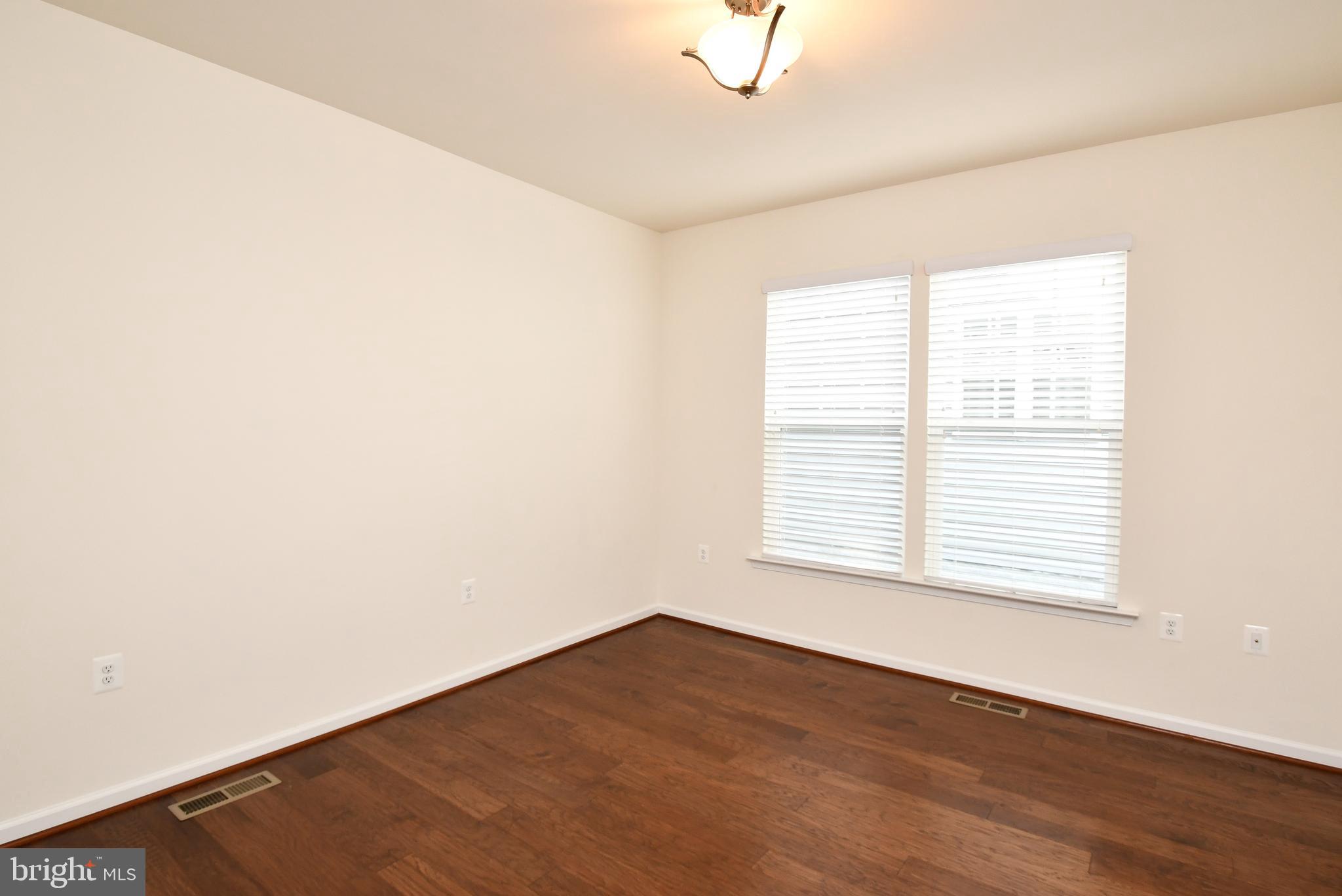 12413 Ruby Red Drive Fredericksburg, VA 22407 - Photo 34 of 54 Bedroom w/ hardwood, hanging light & double window