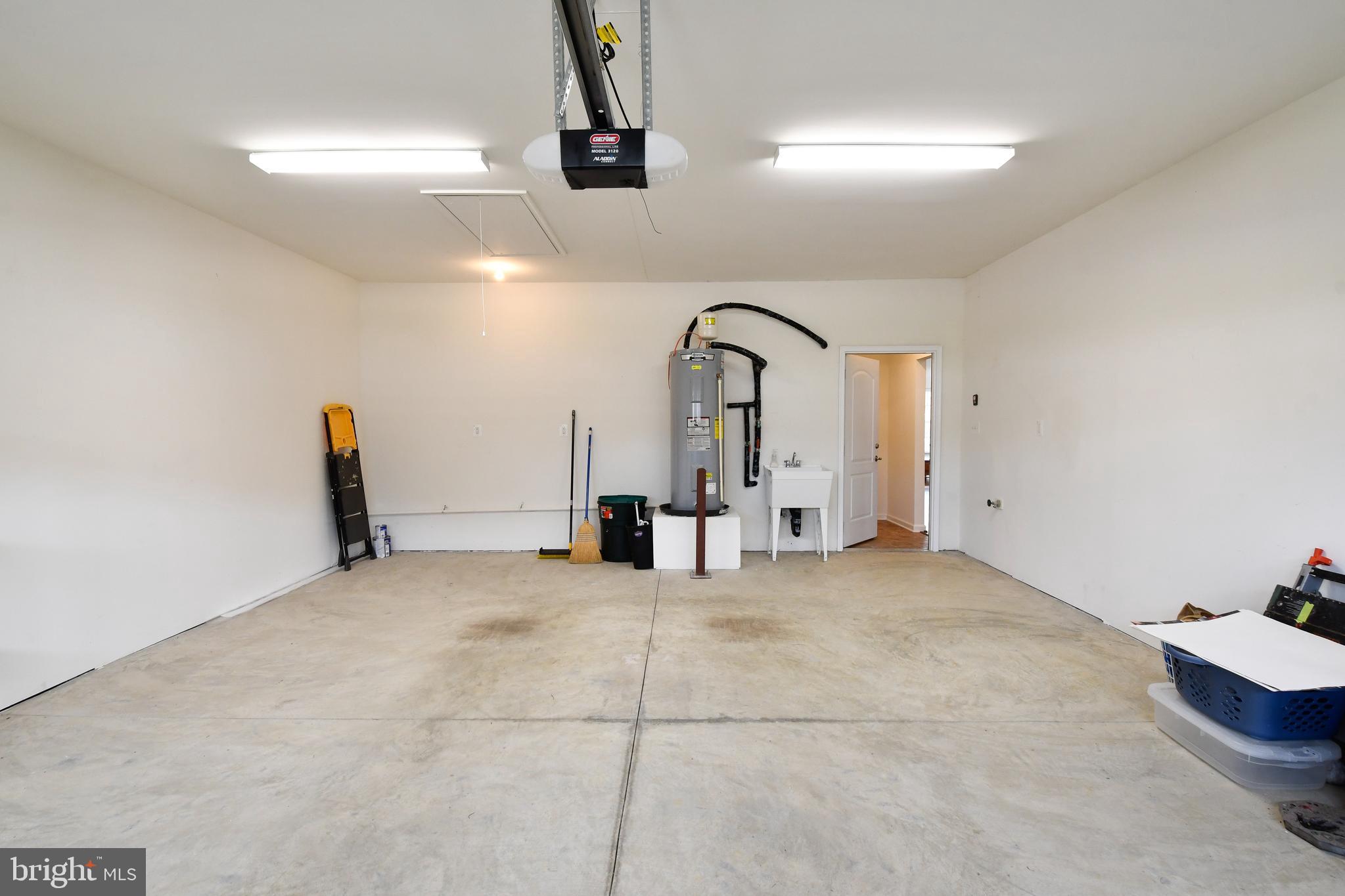 12413 Ruby Red Drive Fredericksburg, VA 22407 - Photo 42 of 54 Oversized garage with laundry tub sink