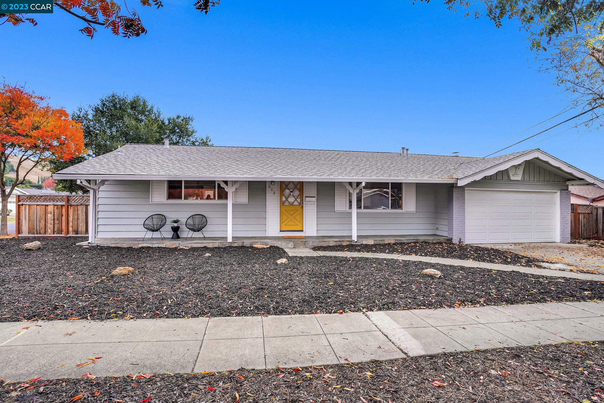 front view of a house with a yard