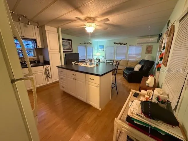 a kitchen with a sink appliances and cabinets
