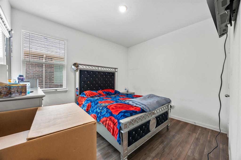753 Lombard Lane Forney, TX 75126 - Photo 15 of 25 Bedroom with wood finished floors, multiple windows, and recessed lighting