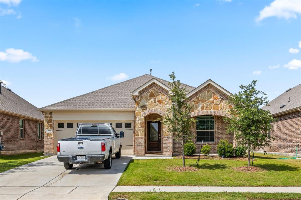 753 Lombard Lane Forney, TX 75126 - Photo 2 of 25 French country inspired facade with stone siding, driveway, an attached garage, and brick siding