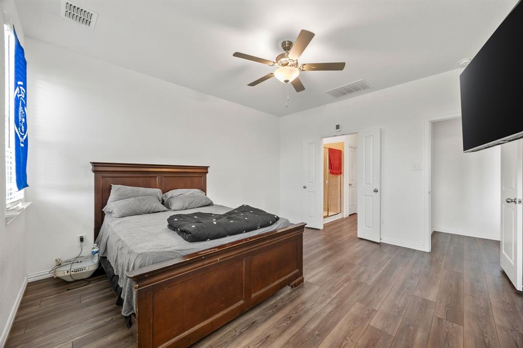 753 Lombard Lane Forney, TX 75126 - Photo 20 of 25 Bedroom featuring wood finished floors and ceiling fan