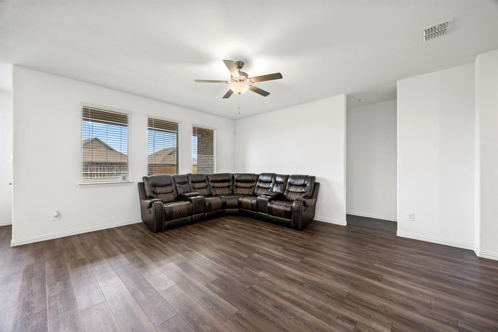 753 Lombard Lane Forney, TX 75126 - Photo 6 of 25 Living room with a ceiling fan and dark wood-type flooring