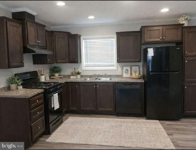 868 East Commerce Street Bridgeton, NJ 08302 - Photo 3 of 4 a kitchen with a sink stove and refrigerator