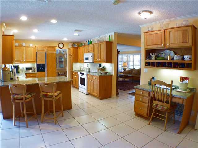 827 Northeast 33rd Street Boca Raton, FL 33431 - Photo 14 of 25 a living room with lots of furniture and kitchen view