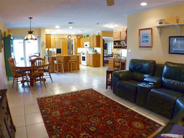 827 Northeast 33rd Street Boca Raton, FL 33431 - Photo 17 of 25 a living room with lots of furniture and a table