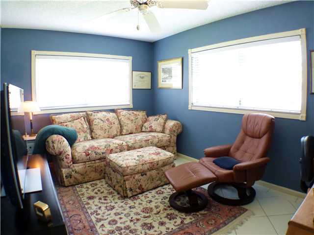 827 Northeast 33rd Street Boca Raton, FL 33431 - Photo 22 of 25 a living room with furniture and a large window