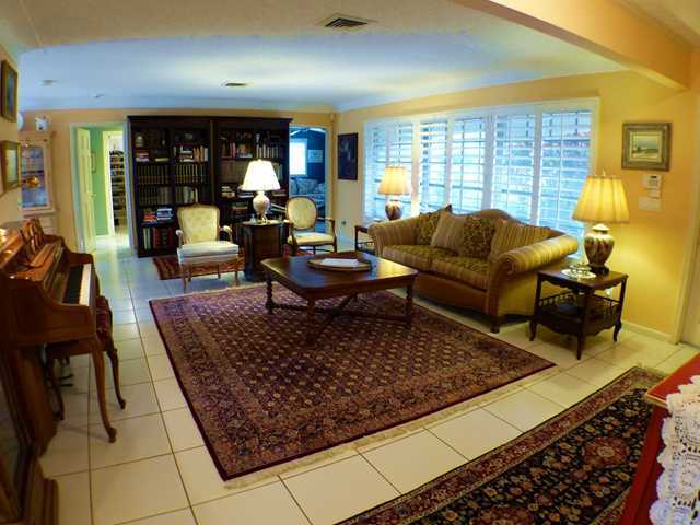 827 Northeast 33rd Street Boca Raton, FL 33431 - Photo 5 of 25 a living room with furniture and a large window