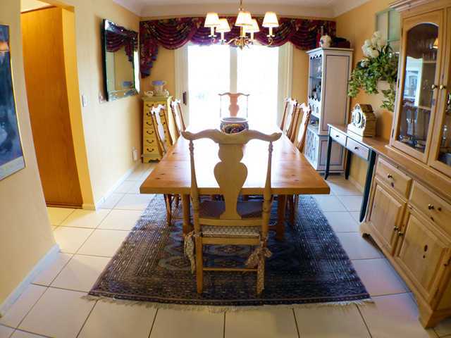827 Northeast 33rd Street Boca Raton, FL 33431 - Photo 7 of 25 a view of a dining room with furniture window and wooden floor