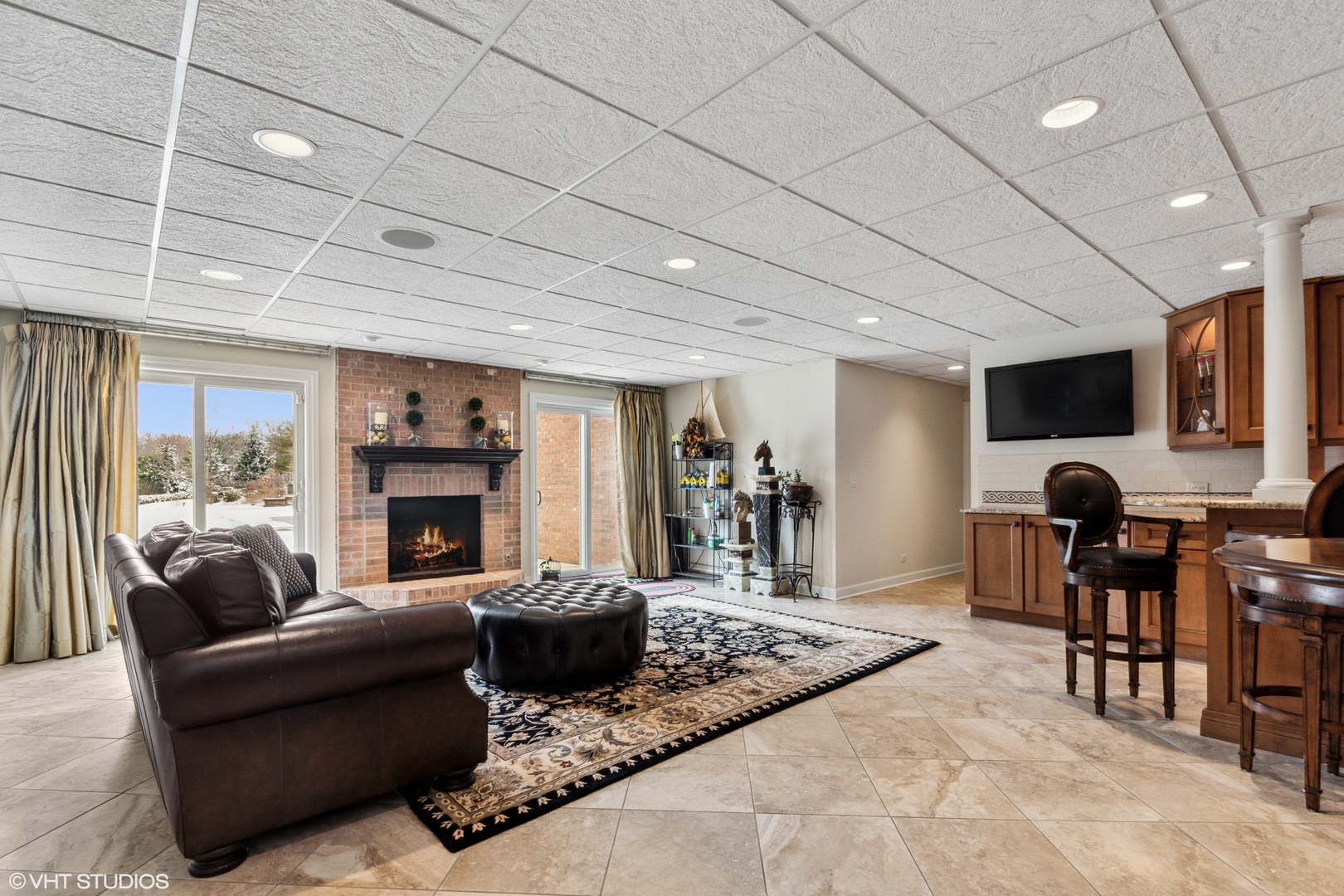 11 Moate Lane Barrington Hills, IL 60010 - Photo 32 of 71 a living room with furniture a fireplace and a flat screen tv