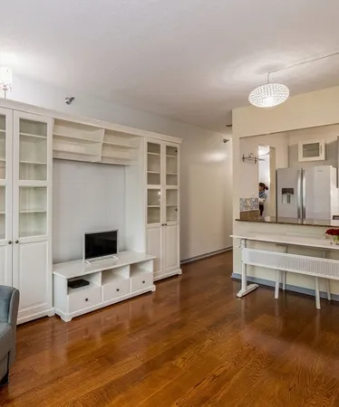 a view of a livingroom with furniture and a flat screen tv