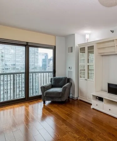 a living room with furniture and a large window