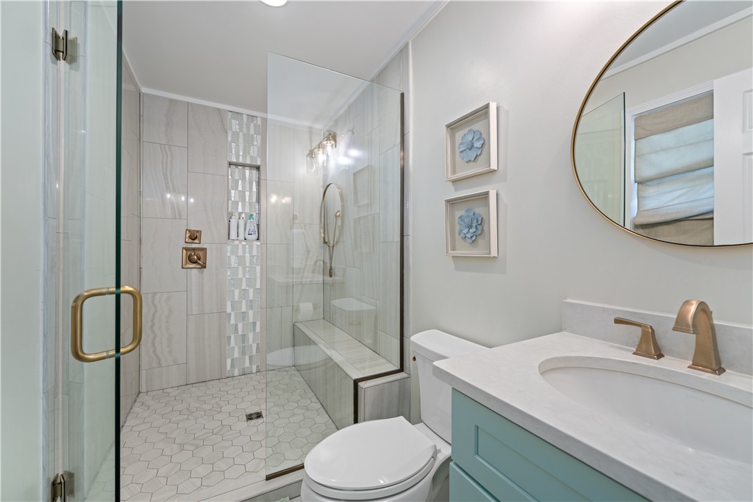 640 Old Salem Road Seneca, SC 29672 - Photo 13 of 32 This sleek bathroom features a spacious walk-in shower with stylish tile work and a modern vanity.