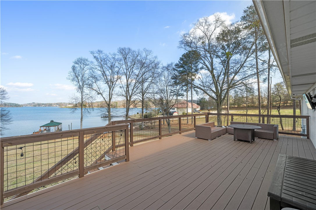 640 Old Salem Road Seneca, SC 29672 - Photo 20 of 32 This spacious deck offers unparalleled waterfront views, ideal for outdoor gatherings and peaceful moments.