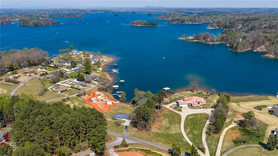640 Old Salem Road Seneca, SC 29672 - Photo 24 of 32 This aerial view showcases waterfront properties along a sprawling lake with lush green landscapes.