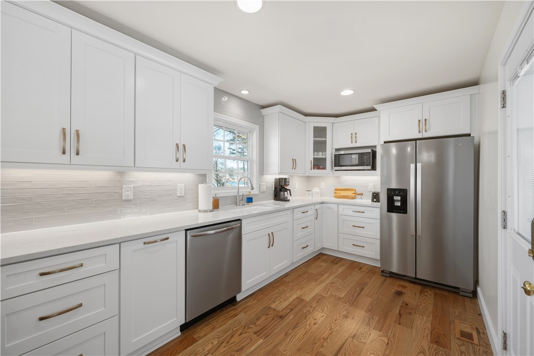 640 Old Salem Road Seneca, SC 29672 - Photo 6 of 32 This bright and airy kitchen features abundant cabinetry, modern appliances, and beautiful wood flooring.
