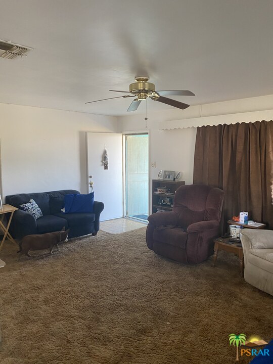 6638 Outpost Road Joshua Tree, CA 92252 - Photo 8 of 11 a living room with furniture and a window