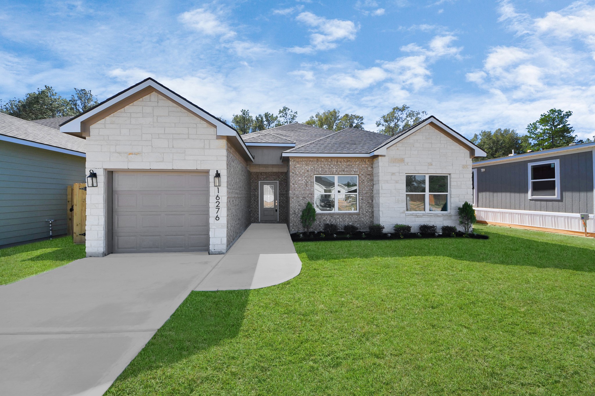 a front view of house with yard and green space