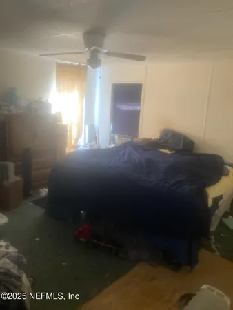 an aerial view of a house with outdoor space