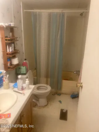 a view of staircase with white walls