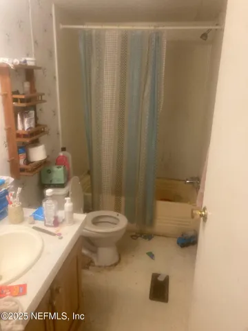 a view of staircase with white walls