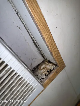 a en suite bathroom with a tub sink and mirror